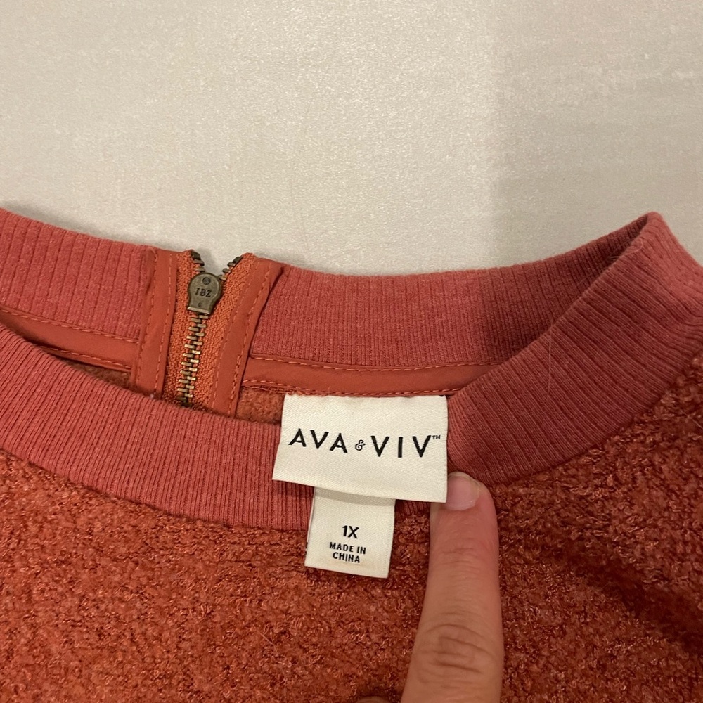 Rust orange crew neck with zipper on the back
